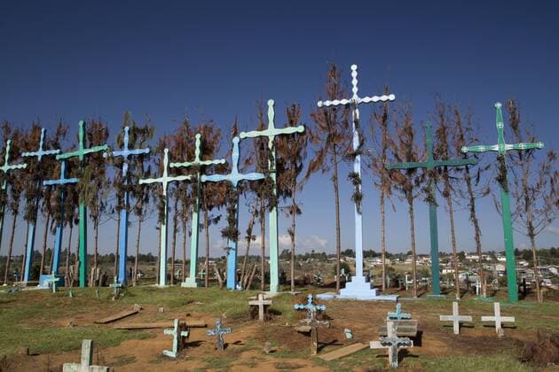 A series of tall crosses at the crest of the graveyard, boards represent doors to and from the grave, village of El Romerillo, Chiapas, Mexico, North America Copyright: RichardxMaschmeyer 801-1052