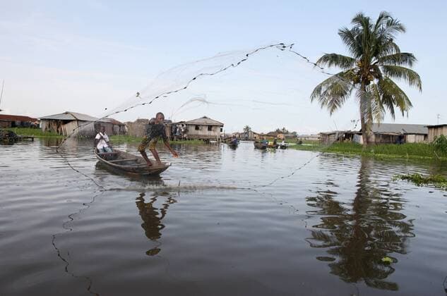 Fishing in Ganvie lake village on Nokoue Lake, Benin, West Africa, Africa Copyright: Godong 809-4436