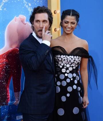 Cast member Matthew McConaughey, the voice of Buster Moon in the animated motion picture comedy Sing and his wife, model Camila Alves attend the premiere of the film the Microsoft Theater in Los Angeles on December 3, 2016. Storyline: A koala named Buster Moon has one final chance to restore his theater to its former glory by producing the world s greatest singing competition.  LAP2016120319 JIMxRUYMEN