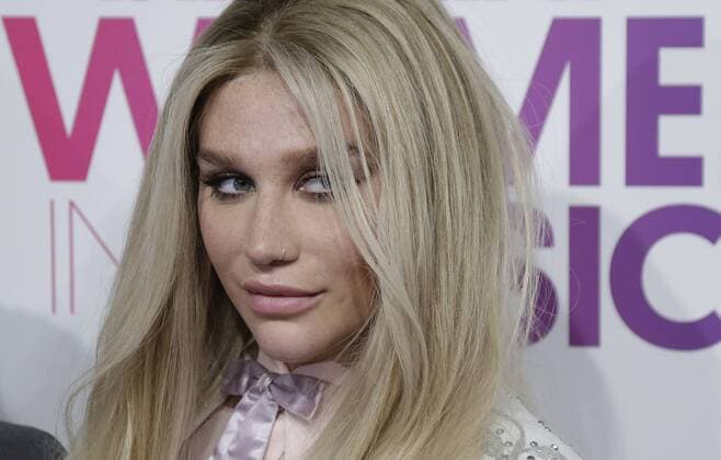 Kesha arrives on the red carpet at the Billboard Women in Music 2016 event on December 9, 2016 in New York City.  NYP20161209120 JOHNxANGELILLO
