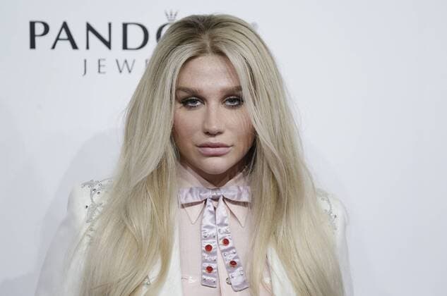 Kesha arrives on the red carpet at the Billboard Women in Music 2016 event on December 9, 2016 in New York City.  NYP20161209121 JOHNxANGELILLO