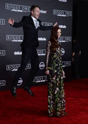 Television personality Chris Hardwick jumps behind his wife, model actress Lydia Hearst, as they attend the premiere of the sci-fi motion picture Rogue One: A Star Wars Story at the Pantages Theatre in the Hollywood section of Los Angeles on December 10, 2016. Storyline: The Rebellion makes a risky move to steal the plans to the Death Star, setting up the epic saga to follow.  LAP2016121047 JIMxRUYMEN