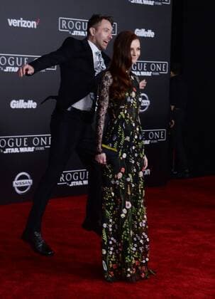Television personality Chris Hardwick jumps behind his wife, model actress Lydia Hearst, as they attend the premiere of the sci-fi motion picture Rogue One: A Star Wars Story at the Pantages Theatre in the Hollywood section of Los Angeles on December 10, 2016. Storyline: The Rebellion makes a risky move to steal the plans to the Death Star, setting up the epic saga to follow.  LAP2016121048 JIMxRUYMEN