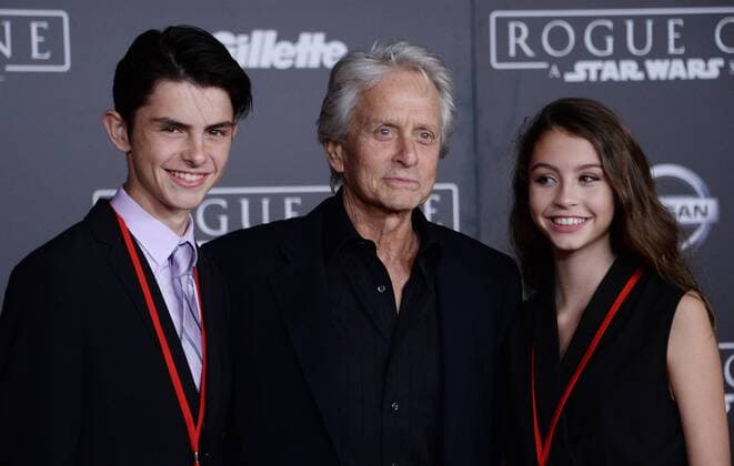 Actor Michael Douglas (C) and his son Dylan Michael Douglas (L) and daughter Carys Zeta Douglas attend the premiere of the sci-fi motion picture Rogue One: A Star Wars Story at the Pantages Theatre in the Hollywood section of Los Angeles on December 10, 2016. Storyline: The Rebellion makes a risky move to steal the plans to the Death Star, setting up the epic saga to follow.  LAP2016121063 JIMxRUYMEN