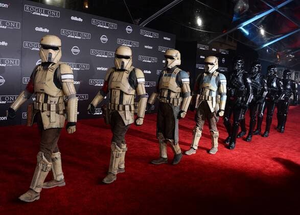 Storm troopers walk the red carpet during the premiere of the sci-fi motion picture Rogue One: A Star Wars Story at the Pantages Theatre in the Hollywood section of Los Angeles on December 10, 2016. Storyline: The Rebellion makes a risky move to steal the plans to the Death Star, setting up the epic saga to follow.  LAP2016121080 JIMxRUYMEN