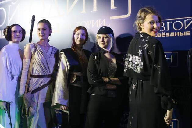 MOSCOW, RUSSIA - DECEMBER 14, 2016: Russian TV presenter and journalist Ksenia Sobchak (R) poses for a group photograph with actors dressed as film characters at the Moscow premiere of Rogue One: A Star War Story, a film by Gareth Edwards, in Moscow s Tesla 4000 multi-format workspace. Vyacheslav Prokofyev TASS  TS03AF9C