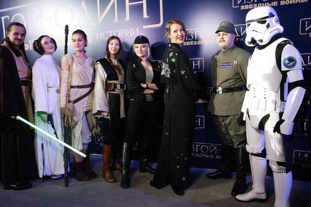 MOSCOW, RUSSIA - DECEMBER 14, 2016: Russian TV presenter and journalist Ksenia Sobchak (3rd R) poses for a group photograph with actors dressed as film characters at the Moscow premiere of Rogue One: A Star War Story, a film by Gareth Edwards, in Moscow s Tesla 4000 multi-format workspace. Vyacheslav Prokofyev TASS  TS03AF9D