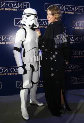 MOSCOW, RUSSIA - DECEMBER 14, 2016: Russian TV presenter and journalist Ksenia Sobchak (R) poses for a photograph with an actor dressed as a stormtrooper at the Moscow premiere of Rogue One: A Star War Story, a film by Gareth Edwards, in Moscow s Tesla 4000 multi-format workspace. Vyacheslav Prokofyev TASS  TS03AF9E