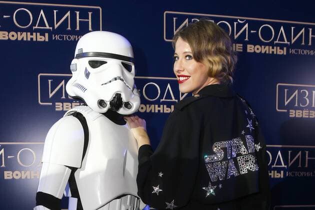 MOSCOW, RUSSIA - DECEMBER 14, 2016: Russian TV presenter and journalist Ksenia Sobchak (R) poses for a photograph with an actor dressed as a stormtrooper at the Moscow premiere of Rogue One: A Star War Story, a film by Gareth Edwards, in Moscow s Tesla 4000 multi-format workspace. Vyacheslav Prokofyev TASS  TS03AFAC