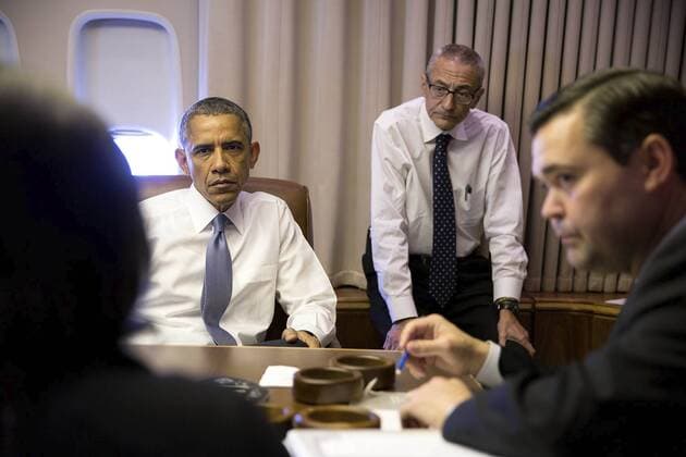 Jan. 24, 2015 - Washington, DC, United States of America - U.S. President Barack Obama holds a meeting with National Security Advisor Susan E. Rice, John Podesta, Counselor to the President and Phil Reiner, Senior Director for South Asian Affairs, aboard Air Force One en route to New Delhi, India January 25, 2015. . Barack Hussein Obama II (born August 4, 1961) is the 44th President of the United States. He is the first African American to be elected to office and the first president born outside the contiguous United States. Born in Honolulu, Hawaii, Obama is a graduate of Columbia University and Harvard Law School. He worked as a civil rights attorney and taught constitutional law at the University of Chicago Law School from 1992 to 2004. While serving three terms representing the 13th District in the Illinois Senate from 1997 to 2004, he ran unsuccessfully in the Democratic primary fo - ZUMAz03_ 20150124_shx_z03_377