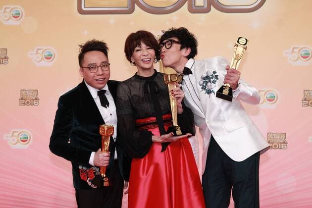 HONG KONG, CHINA - DECEMBER 18: Host Do Do Carol Cheng (C) celebrates with partners hip-hop group FAMA at the backstage of the 2016 TVB Anniversary Awards on December 18, 2016 in Hong Kong, China.  CFP497275749