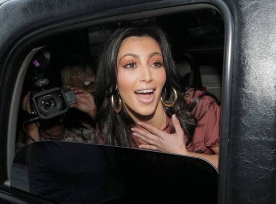 Apr 16, 2008 - Beverly Hills, California, USA - Socialite KIM KARDASHIAN goes on an urban safari and videotapes it. Kim pulled out her trendy safari inspired outfit as she took to the urban jungle of Beverly Hills, the celeb and paparazzi fueled shopping district! Kim wore a terracotta colored button and pocket detail short sleeve belted dress with wooden and gold chuncky bangles and some thick gold hoop earrings. Kim was on a mission this day, and it wasn t shopping, she was videotaping the paparazzi photographing her for a segment in her family reality TV show Keeping up with the Kardashians. - ZUMAl80_ 20080416_zaf_l80_034
