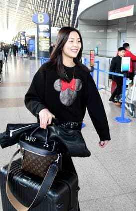 SHANGHAI, CHINA - DECEMBER 31: Fashion model Liu Wen seen at the airport on December 31, 2016 in Shanghai, China.  CFP497682818