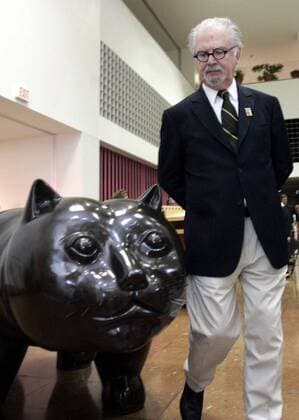 May 23, 2007 - San Antonio, TX, USA - Fernando Botero wanders by his sculpture Cat, at a celebration in his honor at the San Antonio Library in San Antonio, Texas. Fernando Botero is a neo-figurative Colombian artist, self-titled the most Colombian of Colombian artists. He won the first prize at the Sal—n de Artistas Colombianos in 1958, He paints and draws in a style somewhat similar to Pablo Picasso. He strives in all his work to capture an essential part of himself and his subjects through color and form. His work includes still-life and landscapes, but Botero tends to primarily focus on situational portraiture. His paintings and sculptures are, on first examination, noted for their exaggerated proportions and the corpulence of the human figures and animal figures. - ZUMAa27_ 20070523_rnn_a74_032