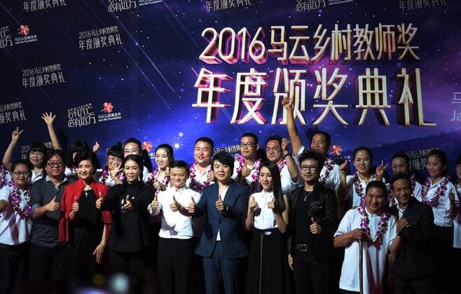 SANYA, Jan. 5, 2017 -- Jack Ma (5th L F) poses for a group photo with winners of the Jack Ma Rural Teachers Award in Sanya, a tourism resort in south China s Hainan Province, on Jan. 5, 2017. The awarding ceremony of the Jack Ma Rural Teachers Award was held on Thursday, with 100 rural teachers winning the award of 100,000 yuan (14,522 U.S. dollars) respectively. ) (wf) CHINA-SANYA-JACK MA-RURAL TEACHERS AWARD (CN) YangxGuanyu 