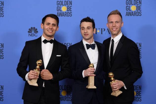Jan 8, 2017 - Beverly Hills, California, U.S - After winning the category of BEST ORIGINAL SONG MOTION PICTURE for City of Stars for La La Land - music by: Justin Hurwitz; lyrics by: Benj Pasek, Justin Paul - pose with the award backstage in the press room at the 74th Annual Golden Globe Awards at the Beverly Hilton in Beverly Hills, CA on Sunday, January 8, 2017. Beverly Hills U.S - ZUMAz03_ 20170108_sha_z03_468