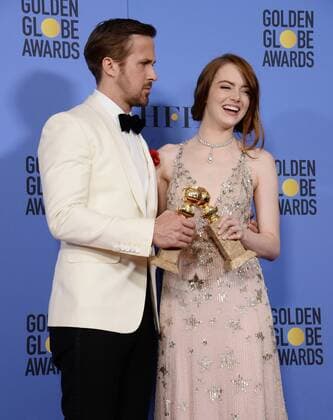 Ryan Gosling and Emma Stone, winners of the awards for Best Performance by an Actor and Actress in a Motion Picture Musical or Comedy respectively for La La Land appear backstage with their trophies during the 74th annual Golden Globe Awards at the Beverly Hilton Hotel in Beverly Hills, California on January 8, 2017.  LAP201701084012 JIMxRUYMEN