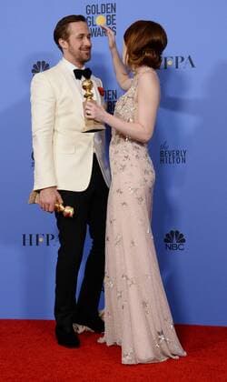 Ryan Gosling and Emma Stone, winners of the awards for Best Performance by an Actor and Actress in a Motion Picture Musical or Comedy respectively for La La Land appear backstage with their trophies during the 74th annual Golden Globe Awards at the Beverly Hilton Hotel in Beverly Hills, California on January 8, 2017.  LAP201701084019 JIMxRUYMEN