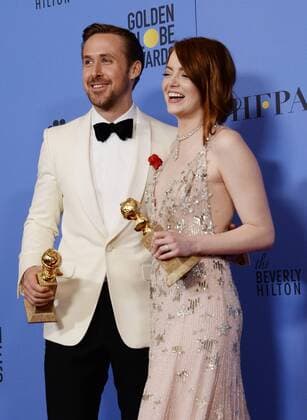 Ryan Gosling and Emma Stone, winners of the awards for Best Performance by an Actor and Actress in a Motion Picture Musical or Comedy respectively for La La Land appear backstage with their trophies during the 74th annual Golden Globe Awards at the Beverly Hilton Hotel in Beverly Hills, California on January 8, 2017.  LAP201701084020 JIMxRUYMEN