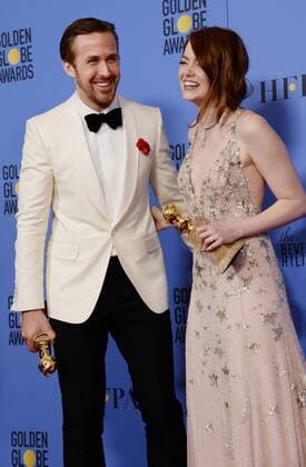 Ryan Gosling and Emma Stone, winners of the awards for Best Performance by an Actor and Actress in a Motion Picture Musical or Comedy respectively for La La Land appear backstage with their trophies during the 74th annual Golden Globe Awards at the Beverly Hilton Hotel in Beverly Hills, California on January 8, 2017.  LAP201701084021 JIMxRUYMEN