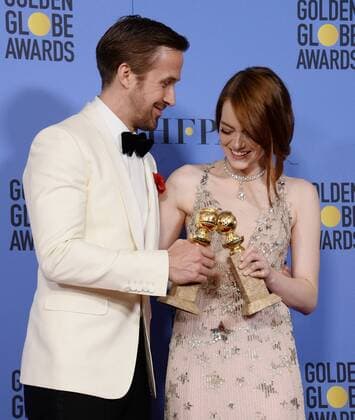 Ryan Gosling and Emma Stone, winners of the awards for Best Performance by an Actor and Actress in a Motion Picture Musical or Comedy respectively for La La Land appear backstage with their trophies during the 74th annual Golden Globe Awards at the Beverly Hilton Hotel in Beverly Hills, California on January 8, 2017.  LAP201701084015 JIMxRUYMEN