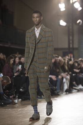 London: Vivienne Westwood Fashion Show Vivienne Westwood s runway at LFW Men s January 2017. A model walks the runway at the Vivienne Westwood show during London Fashion Week Men s collections at Seymour Leisure Centre. Dame Vivienne Isabel Westwood is a British fashion designer and businesswoman, largely responsible for bringing modern punk and new wave fashions into the mainstream. Westwood came to public notice when she made clothes for Malcolm McLaren s boutique in the King s Road, which became famous as SEX  AlbertoxPezzali