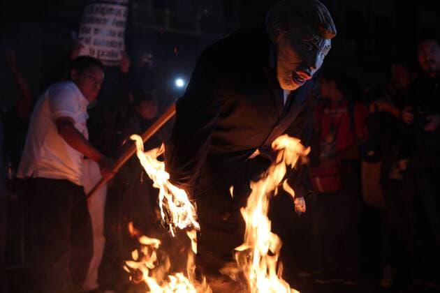 January 9, 2017 - Mexico City, Mexico - Demonstrators burned a figure of Donald Trump, and the Mexican President Enrique PeoÂ±a Nieto in front of Nacional Palace of Mexico City, on 9 January 2017, as a part of the demonstration against fuel prices in all the country. Largely peaceful protests against the fuel price increases continued nationwide in Mexico, and looting seen last week largely subsided. The protests have left hundreds of businesses looted and more than 1,500 detained. Mexico City Mexico  - ZUMAn230 20170109_zaa_n230_041