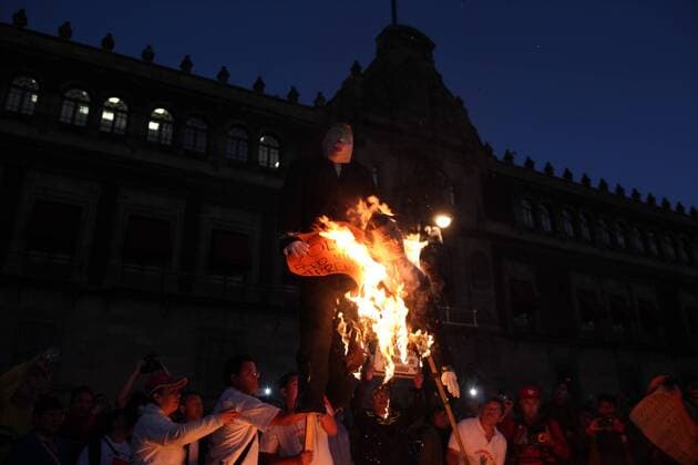 January 9, 2017 - Mexico City, Mexico - Demonstrators burned a figure of Donald Trump, and the Mexican President Enrique PeoÂ±a Nieto in front of Nacional Palace of Mexico City, on 9 January 2017. As a part of the demonstration against fuel prices in all the country. Largely peaceful protests against the fuel price increases continued nationwide in Mexico, and looting seen last week largely subsided. The protests have left hundreds of businesses looted and more than 1,50 Mexico City Mexico  - ZUMAn230 20170109_zaa_n230_051