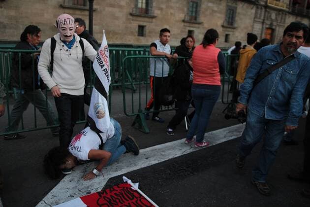 January 9, 2017 - Mexico City, Mexico - Demonstrators wearing masks of the ex president Salinas De Gortari perfms outside Natioal palace of Mexico City, on 9 January 2017, as a way to protest against fuel prices in Mexico the 9 of January of 201.Largely peaceful protests against the fuel price increases continued nationwide in Mexico, and looting seen last week largely subsided. The protests have left hundreds of businesses looted and more than 1,500 detained. Mexico City Mexico  - ZUMAn230 20170109_zaa_n230_056