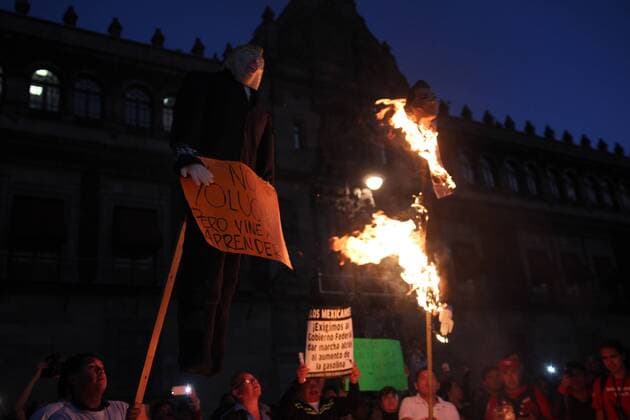 January 9, 2017 - Mexico City, Mexico - Demonstrators burned a figure of Donald Trump, and the Mexican President Enrique PeoÂ±a Nieto in front of Nacional Palace of Mexico City, on 9 January 2017. As a part of the demonstration against fuel prices in all the country. Largely peaceful protests against the fuel price increases continued nationwide in Mexico, and looting seen last week largely subsided. The protests have left hundreds of businesses looted and more than 1,50 Mexico City Mexico  - ZUMAn230 20170109_zaa_n230_057