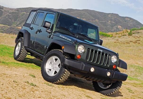 Mar 20, 2007 - Los Angeles, CA, USA - The 2007 Jeep Wrangler Rubicon Four-Door. The new Jeep Wrangler Unlimited takes on a radical four-door open-air design with JeepÕs signature design cues-classic round headlamps, seven-slot grille, trapezoidal wheels flares, exposed forged hinges combined with Wrangler UnlimitedÕs longer wheelbase, front-hinged B-pillar and larger sport bar-creating a stance that commands attention.  - ZUMA 20070320_cob_s06_818