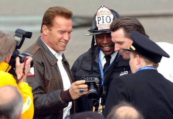 Nov 16, 2006; San Francisco, CA, USA; Gov. ARNOLD SCHWARZENEGGER shows off the digital picture he just took of San Francisco Mayor Gavin Newsom, and Lt. Ken Smith and Chief Joanne Hayes-White of the San Francisco Fire Department during the Golden Guardian Exercise, a regional disaster drill at Treasure Island Thursday Nov. 16, 2006. Mandatory - ZUMAc99_ 20061116_mdm_c99_825