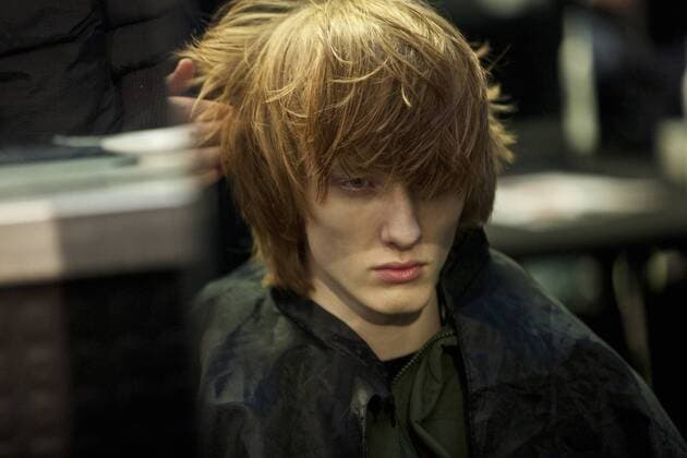 (170114) -- MILAN, Jan. 14, 2017 -- A model has his hair made backstage before Diesel Black Gold men s Fall-Winter 2017-2018 collection during Milan Fashion Week in Milan, Italy, on Jan. 14, 2017.) (zy) ITALY-MILAN-FASHION WEEK-MEN-DIESEL BLACK GOLD-BACKSTAGE JinxYu 