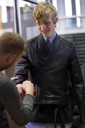 (170114) -- MILAN, Jan. 14, 2017 -- A model has his clothes changed backstage before Diesel Black Gold men s Fall-Winter 2017-2018 collection during Milan Fashion Week in Milan, Italy, on Jan. 14, 2017. ) (zy) ITALY-MILAN-FASHION WEEK-MEN-DIESEL BLACK GOLD-BACKSTAGE JinxYu 