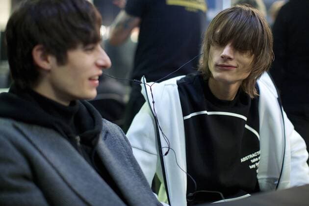(170114) -- MILAN, Jan. 14, 2017 -- Two models enjoy music backstage ahead of the Diesel Black Gold show during Milan Fashion Week in Milan, Italy, on Jan. 14, 2017. ) (zy) ITALY-MILAN-FASHION WEEK-MEN-DIESEL BLACK GOLD-BACKSTAGE JinxYu 