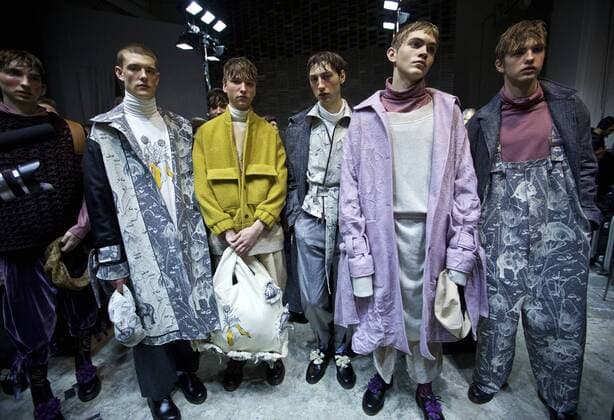MILAN, Jan. 16, 2017 -- Models pose for photo at backstage ahead of the Fall Winter 2017 18 menswear collection of MIAORAN during Milan Fashion Week in Milan, Italy, on Jan. 16, 2017. )(gl) ITALY-MILAN-FASHION WEEK-MEN-CHINESE DESIGNER-MIAORAN JinxYu 