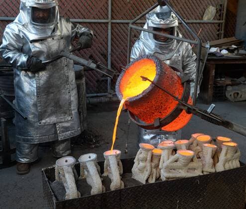 Workers in fire suits pour molten bronze metal into molds during the casting of the Screen Actors Guild Award statuettes at the American Fine Arts Foundry in Burbank, California on January 17, 2017. Winners are to be announced during a live simulcast on TNT and TBS in Los Angeles on January 29, 2017.  LAP2017011707 JIMxRUYMEN