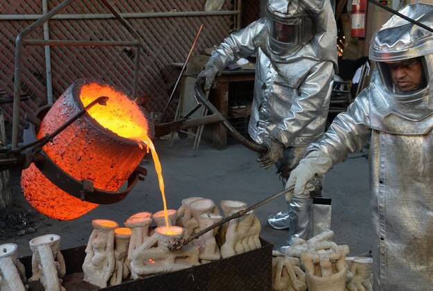 Workers in fire suits pour molten bronze metal into molds during the casting of the Screen Actors Guild Award statuettes at the American Fine Arts Foundry in Burbank, California on January 17, 2017. Winners are to be announced during a live simulcast on TNT and TBS in Los Angeles on January 29, 2017.  LAP2017011712 JIMxRUYMEN