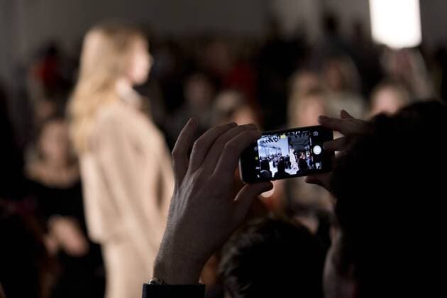 January 17, 2017 - Berlin, Germany - A guest takes a picture with his phone at the Holy Ghost fashion show during the Mercedes-Benz Berlin Fashion Week Autumn Winter 2017 in Berlin, Germany on January 17, 2017. Berlin Germany  - ZUMAn230 20170117_zaa_n230_201