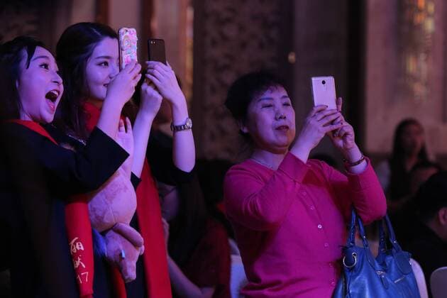 Shenyang, China - Shenyang, CHINA-January 14 2017: (EDITORIAL USE ONLY. CHINA OUT) ..Women take photos of the male models walking on the runway during a fake Victoria s Secret fashion show in Shenyang, northeast China s Liaoning Province. A plastic surgery hospital held the Victoria s Secret Fashion Show , hiring models to wear wings and lingerie during the show, which attracted many people. Shenyang China  - ZUMAs145 20170118_zaa_s145_028