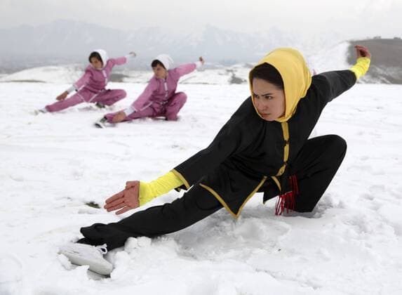 KABUL, Jan. 18, 2017 -- Seema Azimi (Front) teaches Afghan girls Wushu on the top of a hill in Kabul, capital of Afghanistan, Jan. 18, 2017. There are 20 Afghan girls learn Wushu in the Shaolin Wushu club in Kabul. Most of them are students. The eldest girl among them is 20 years old, and the youngest one is only 13 years old. They have been practicing this martial sport for almost two years. ) (SP)AFGHANISTAN-KABUL-WOMEN-WUSHU RahmatxAlizadah 