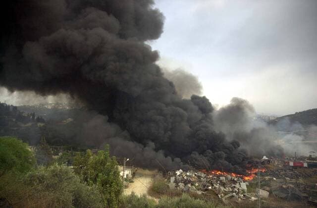 Jul 22, 2006; Beirut, LEBANON; A massive plume of smoke dominates the skyline of the foothills east of Beirut after an Israeli air attack on a suspected Hezbollah convoy set off a fire at a tire dump. Mandatory - ZUMAi55_ 20060722_rnn_i55_072