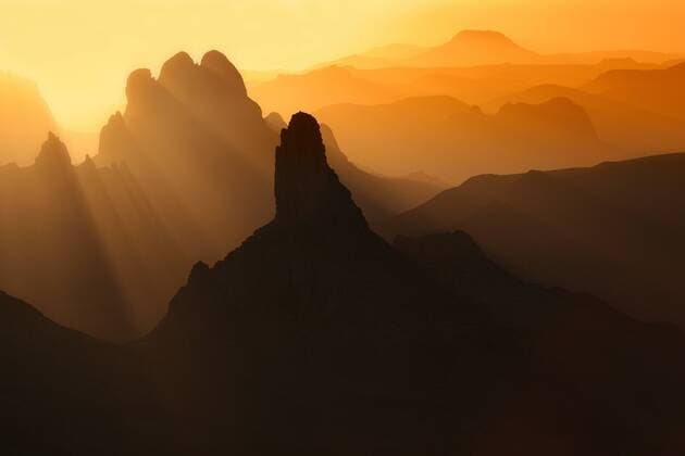 Algeria, Wilaya Tamanrasset, Hoggar Mountains with volcanic rocks at sunrise  DSGF01415