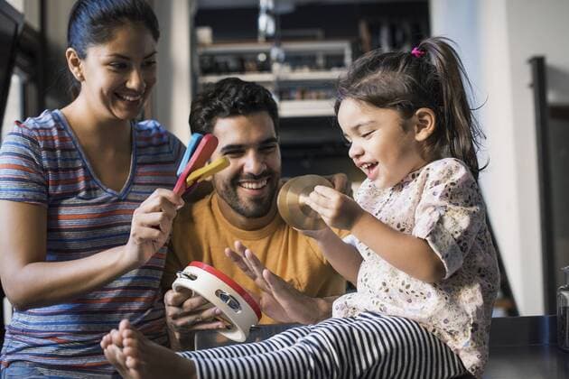 Mother and father making music with their little daughter model released Symbolfoto property released  WESTF22441