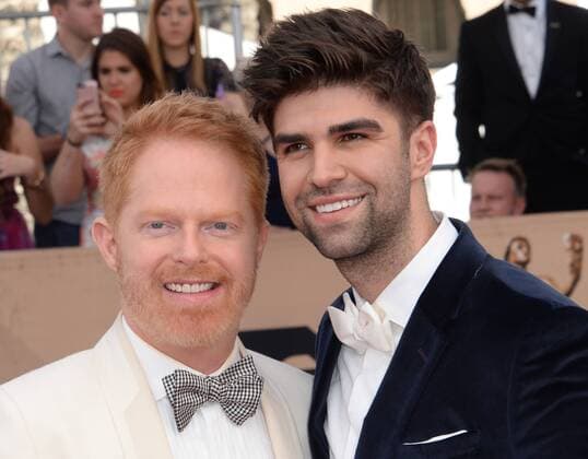 (L-R) Actor Jesse Tyler Ferguson and Justin Mikita arrive for the 23rd annual SAG Awards held at the Shrine Auditorium in Los Angeles on January 29, 2017. The Screen Actors Guild Awards will be broadcast live on TNT and TBS.  LAP20170129778 JIMxRUYMEN