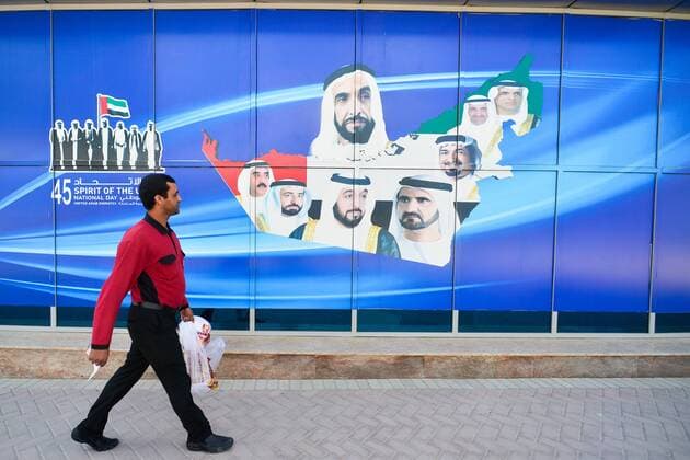 January 30, 2017 - Dubai, United Arab Emirates - A man passes in front of an add Spirit of the Union named official theme for UAE National Day 2016, seen in Dubai Marina area..On Monday, 30 January 2017, in Dubai, UAE. Dubai United Arab Emirates  - ZUMAn230 20170130_zaa_n230_264 Copyright: xArturxWidakx