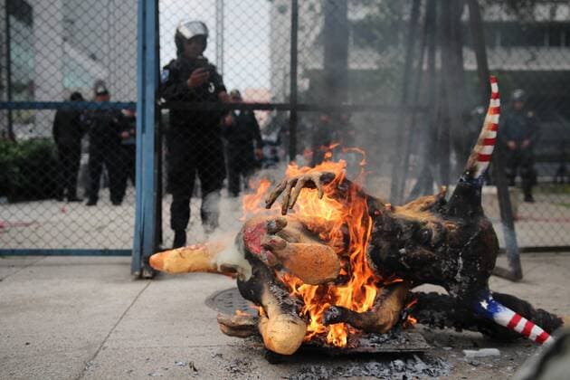 January 31, 2017 - Mexico City, Mexico - An alebrije, or sculpture of a fantastical creature, representing U.S. President Donald Trump with horns and a tail burns in front of the U.S. Embassy in Mexico City, Tuesday, Jan. 31, 2017. Thousands protested in the capital Tuesday, as rural residents from across the country denounced a gasoline price hike that has raised the price of tractor fuel, protested the governments of Mexico and the U.S., and called for the renegotiation of NAFTA to make it more favorable to small farmers. Mexico City Mexico - ZUMAn230 20170131_zaa_n230_274 Copyright: xEmilioxEspejelx