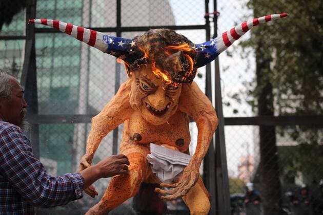 January 31, 2017 - Mexico City, Mexico - An alebrije, or sculpture of a fantastical creature, representing U.S. President Donald Trump with horns and a tail burns in front of the U.S. Embassy in Mexico City, Tuesday, Jan. 31, 2017. Thousands protested in the capital Tuesday, as rural residents from across the country denounced a gasoline price hike that has raised the price of tractor fuel, protested the governments of Mexico and the U.S., and called for the renegotiation of NAFTA to make it more favorable to small farmers. Mexico City Mexico - ZUMAn230 20170131_zaa_n230_275 Copyright: xEmilioxEspejelx