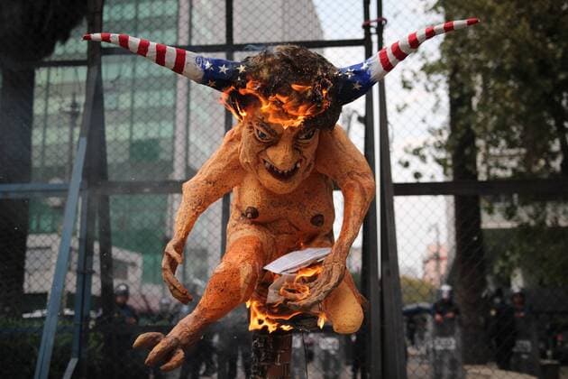 January 31, 2017 - Mexico City, Mexico - An alebrije, or sculpture of a fantastical creature, representing U.S. President Donald Trump with horns and a tail burns in front of the U.S. Embassy in Mexico City, Tuesday, Jan. 31, 2017. Thousands protested in the capital Tuesday, as rural residents from across the country denounced a gasoline price hike that has raised the price of tractor fuel, protested the governments of Mexico and the U.S., and called for the renegotiation of NAFTA to make it more favorable to small farmers. Mexico City Mexico - ZUMAn230 20170131_zaa_n230_283 Copyright: xEmilioxEspejelx