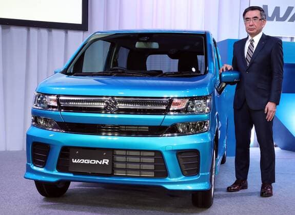 February 1, 2017, Tokyo, Japan - Japan s minicar maker Suzuki Motor president Toshihiro Suzuki displays the mini wagon Wagon R which has 660cc engine or engine electric-motor hybrid system to drive roomy body in Tokyo on February 1, 2017. The new Wagon R has various safety devices and minicar s first head-up display.  (lwxa007941)